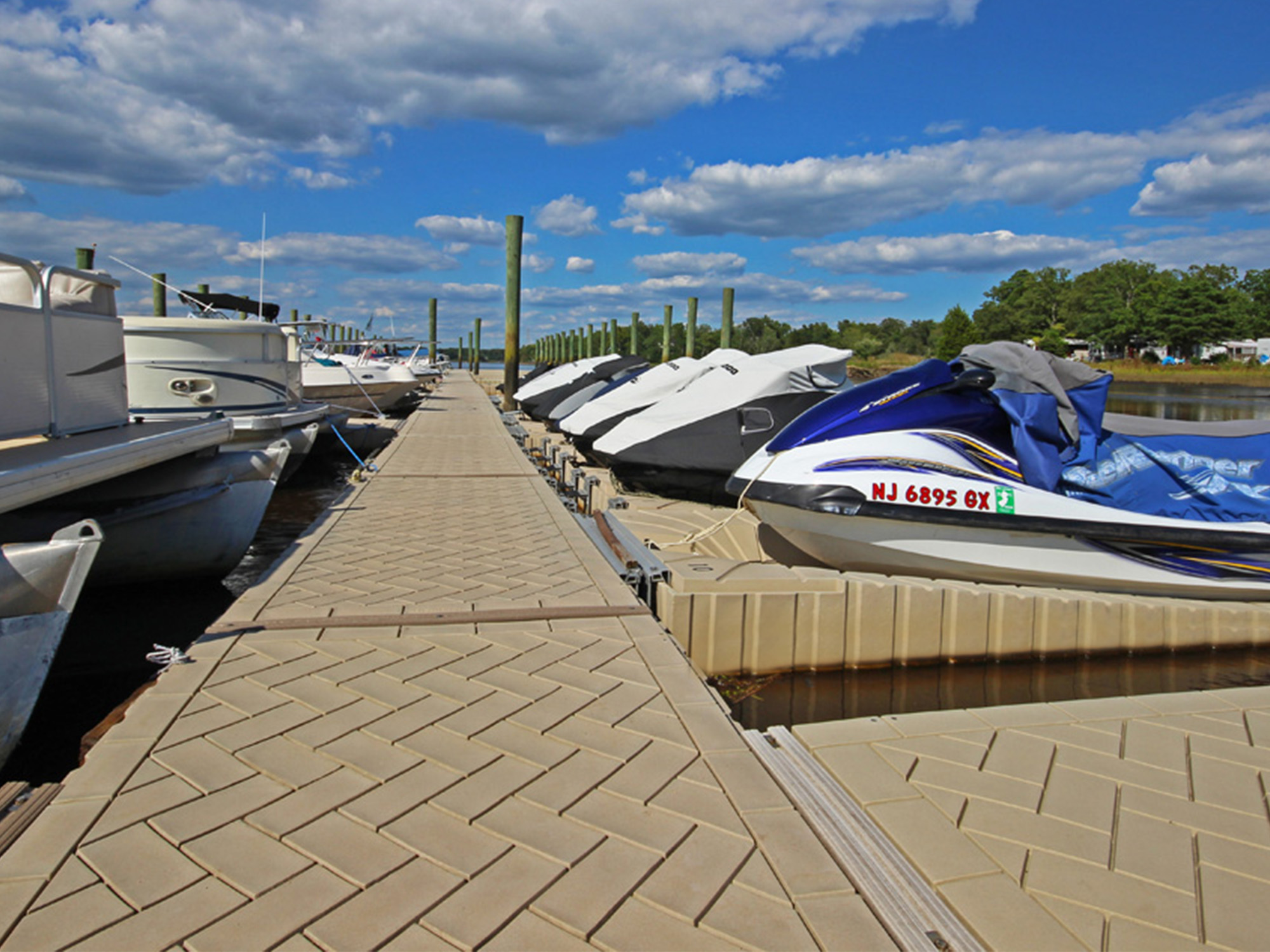 a row of boats sitting next to each other on a pier