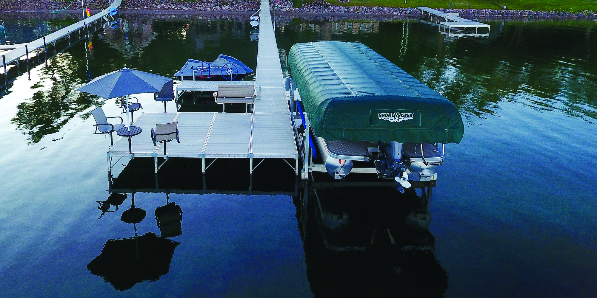 Boat dock with chairs and umbrellas on the water